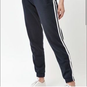 Brandy Melville black joggers with white stripes!